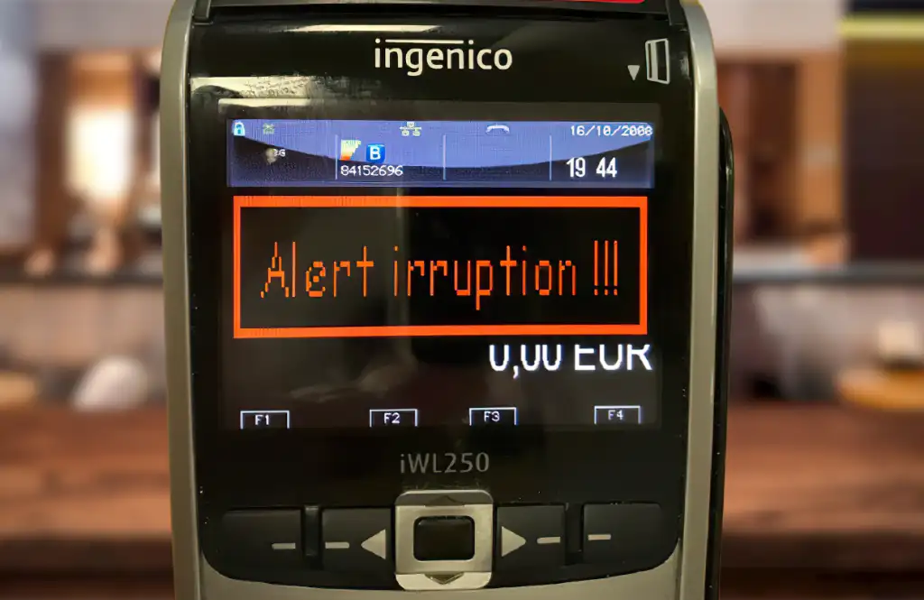 TPE Ingenico iWL250 affichant l'Erreur 'Alert Irruption' suite à une tentative d'ouverture